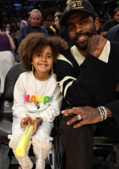 Azurie Elizabeth Irving accompanying her dad Kyrie Irving in his game